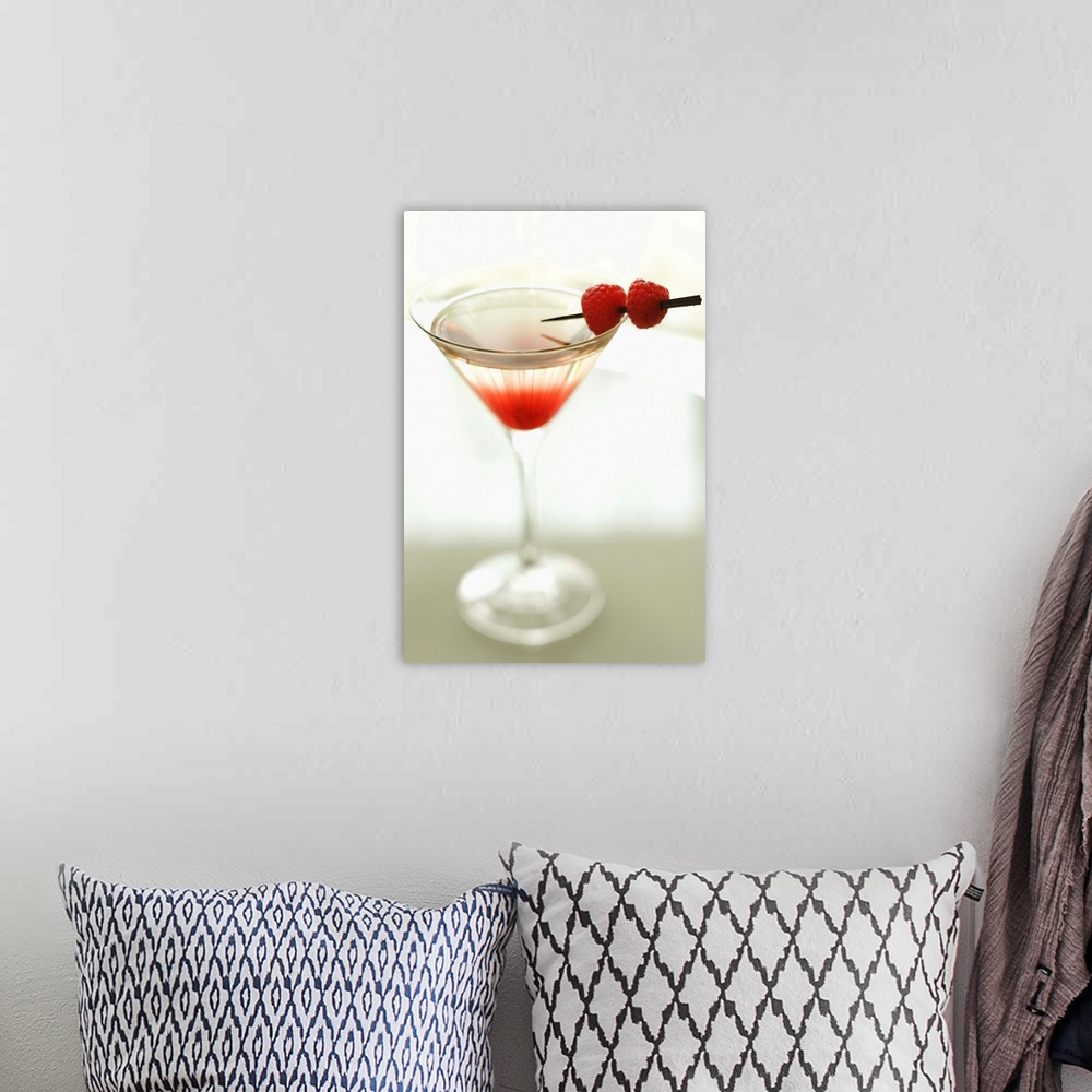 A bohemian room featuring Drink in martini glass with raspberries