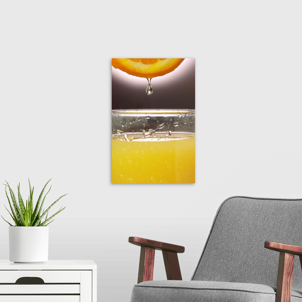A modern room featuring Droplet of orange going into juice