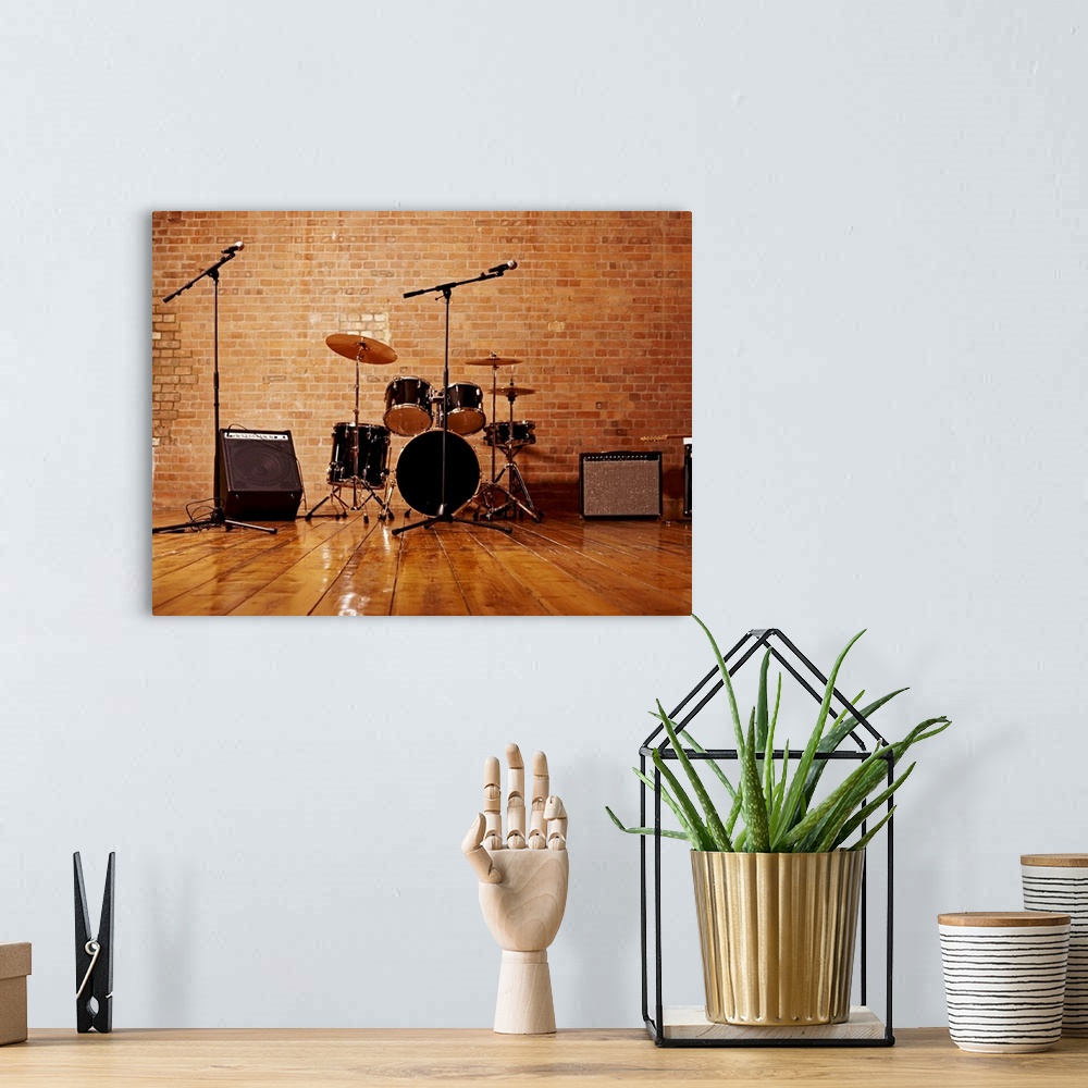 A bohemian room featuring Photograph of musical instruments including a snare drum, bass, high hat cymbal, and crash cymbal...