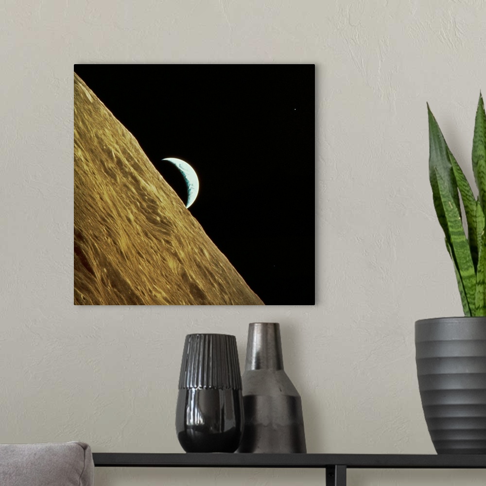 A modern room featuring Earth and Moon