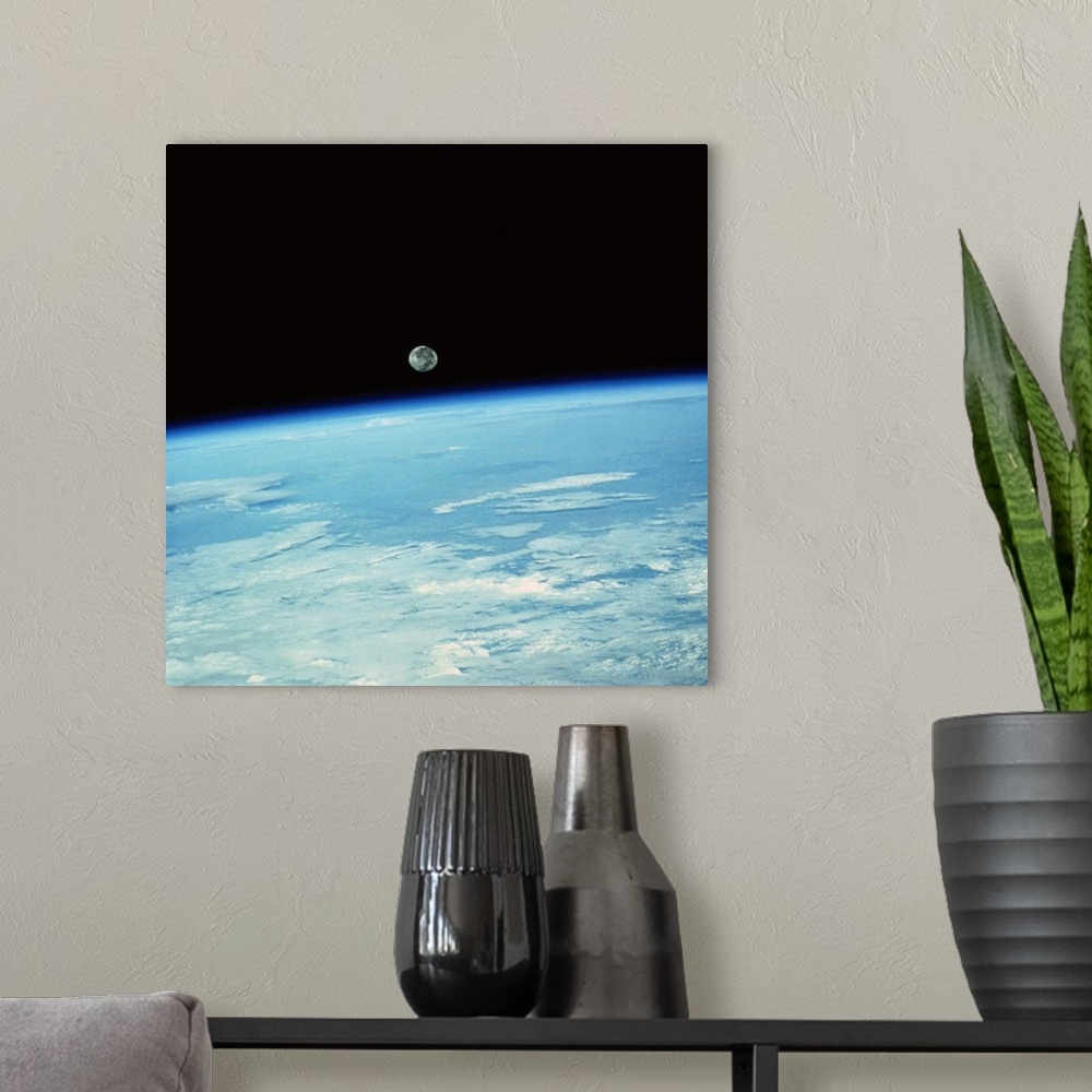 A modern room featuring Earth from Space