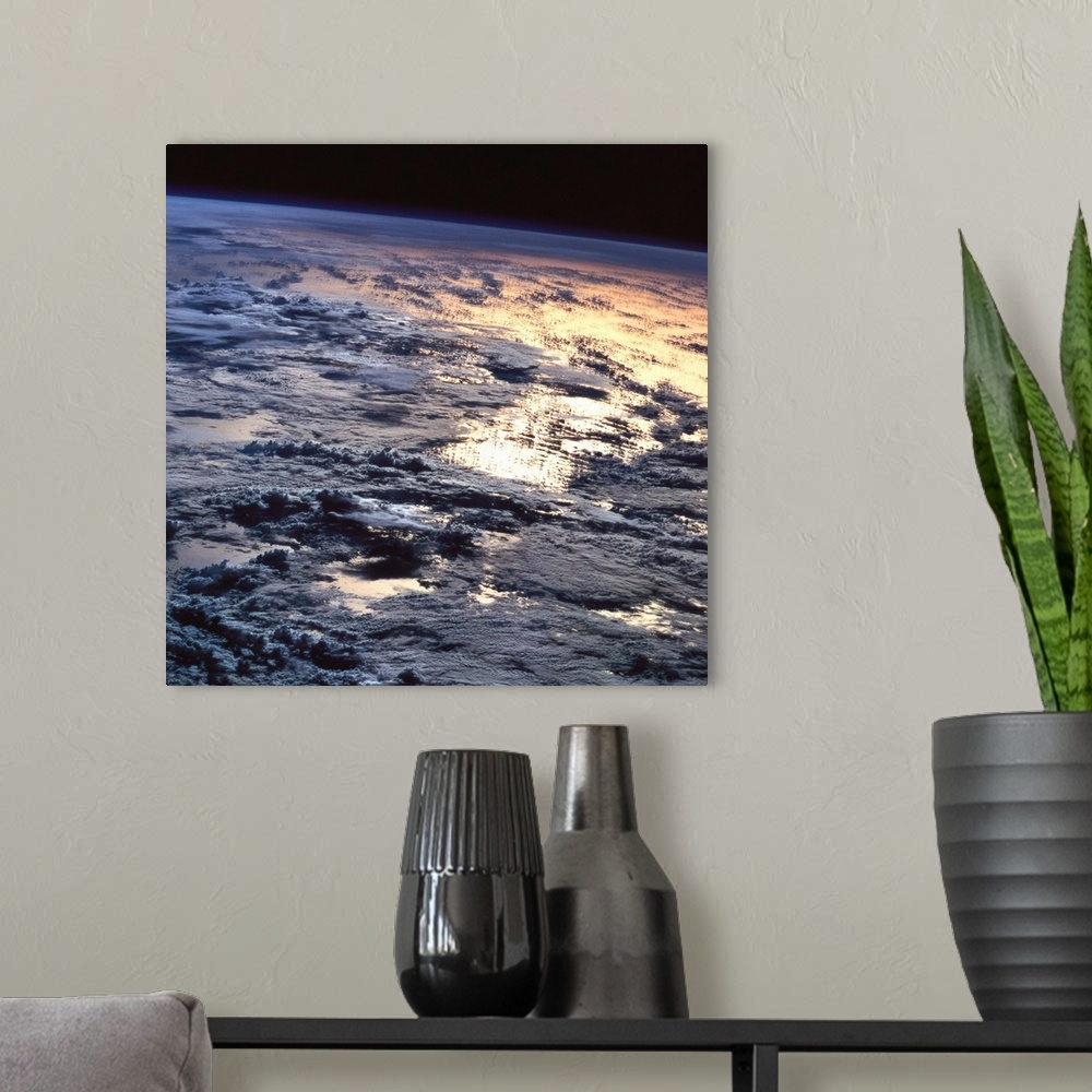 A modern room featuring Earth viewed from a satellite