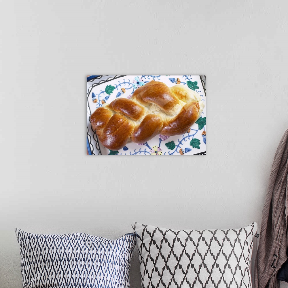 A bohemian room featuring Egg bread on challah plate