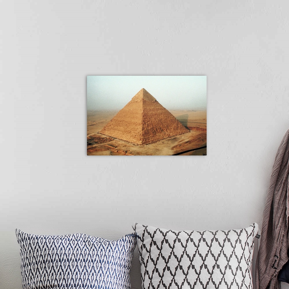 A bohemian room featuring Egyptian pyramid