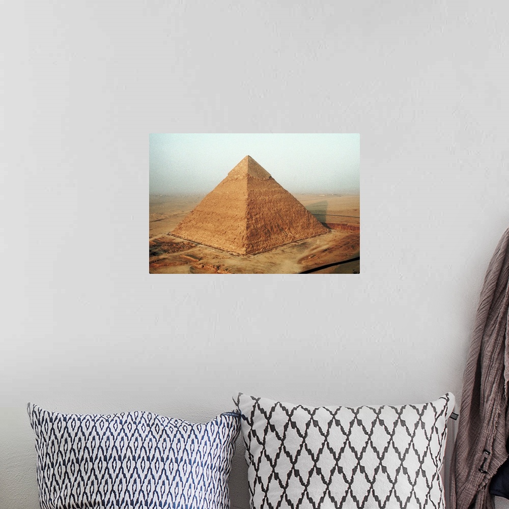 A bohemian room featuring Egyptian pyramid