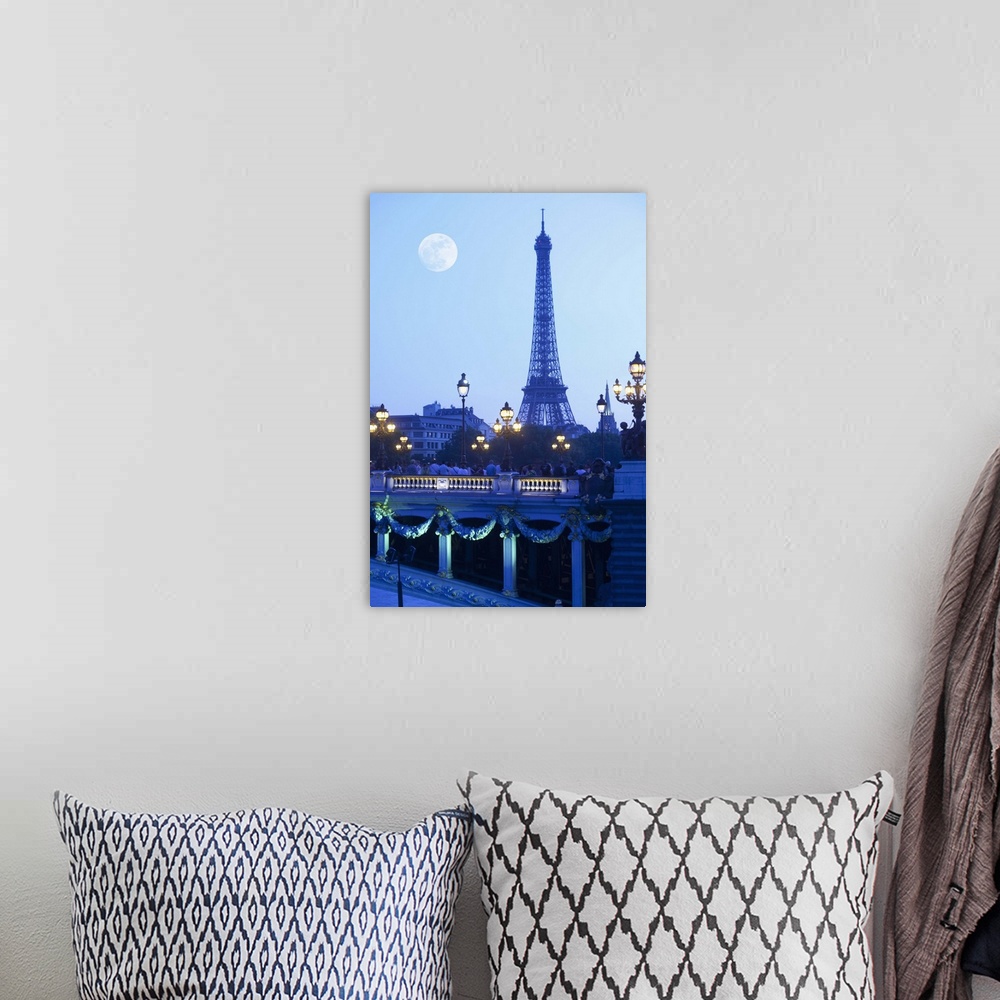 A bohemian room featuring Eiffel tower at dusk with moonrise