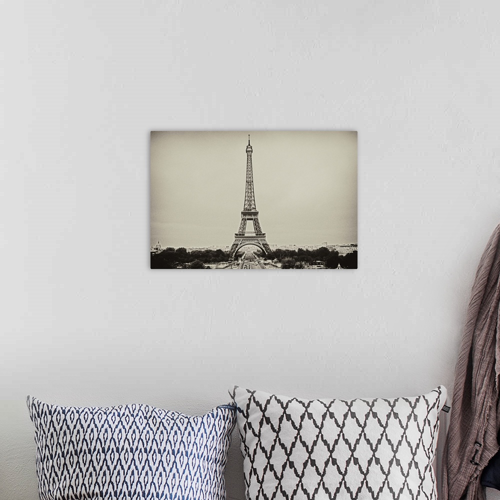A bohemian room featuring Eiffel Tower in old style black and white image.
