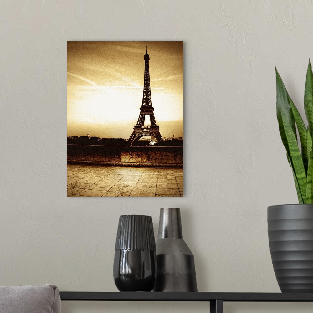 A modern room featuring Tall photo on canvas of the Eiffel Tower in sepia tones.