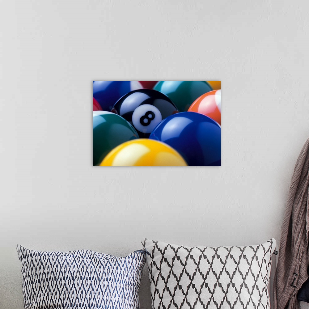 A bohemian room featuring The focus of this picture is the eight ball as all other pool balls are turned so the number is n...