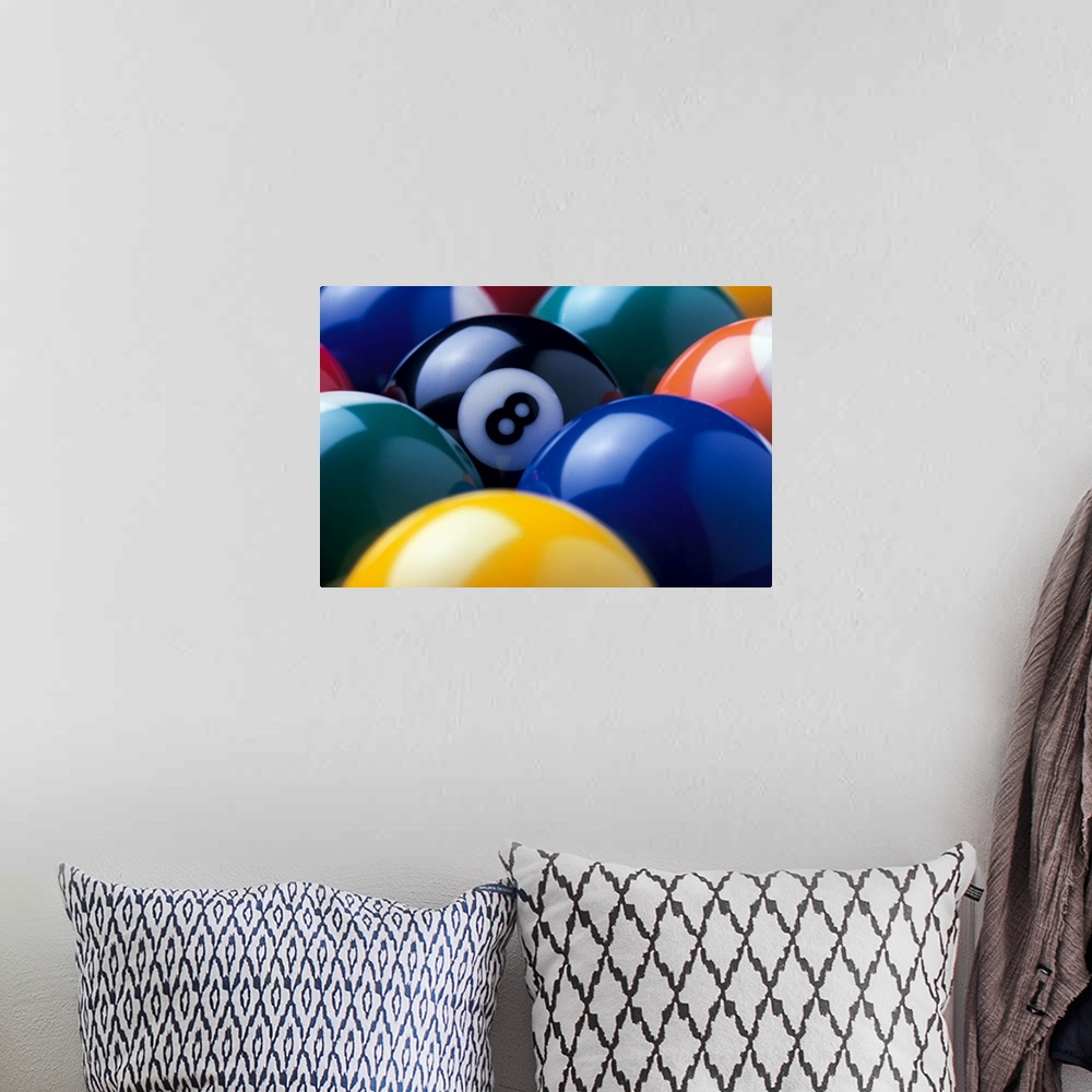 A bohemian room featuring The focus of this picture is the eight ball as all other pool balls are turned so the number is n...