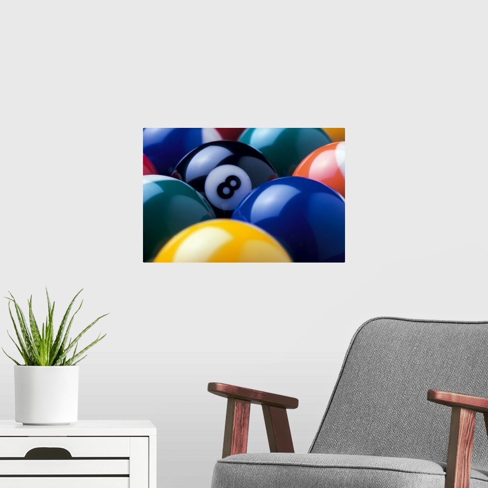 A modern room featuring The focus of this picture is the eight ball as all other pool balls are turned so the number is n...