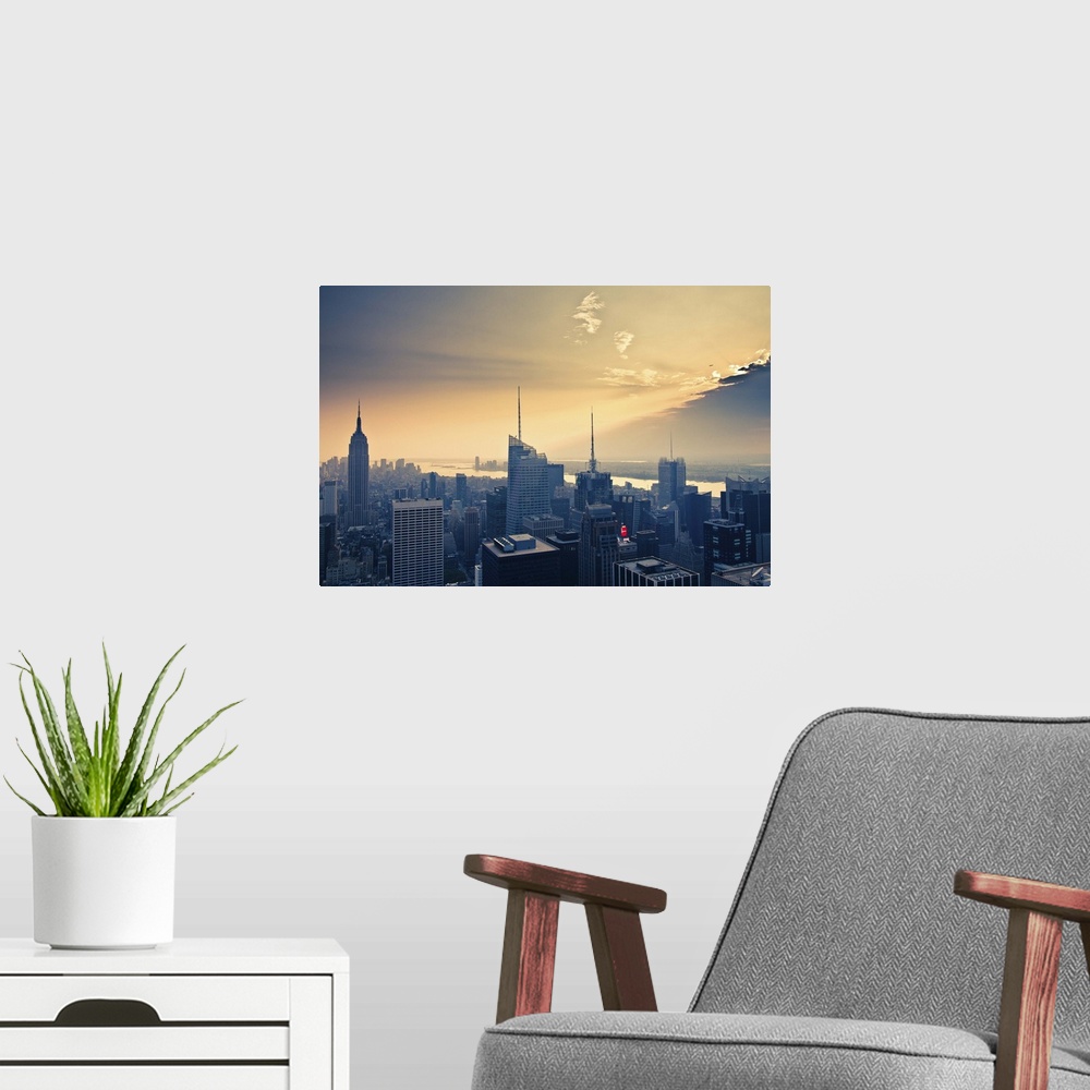A modern room featuring Empire State Building and airplane flying into clouds.