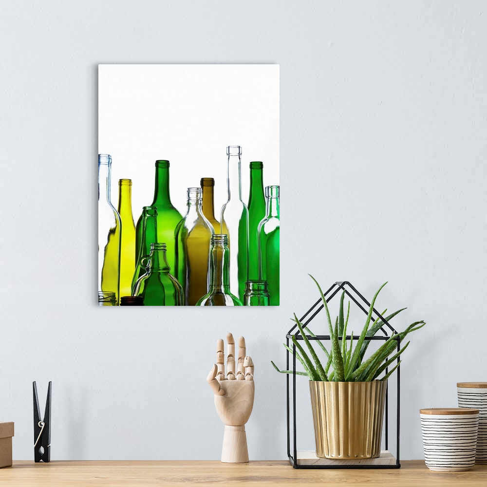 A bohemian room featuring Empty glass bottles on white background