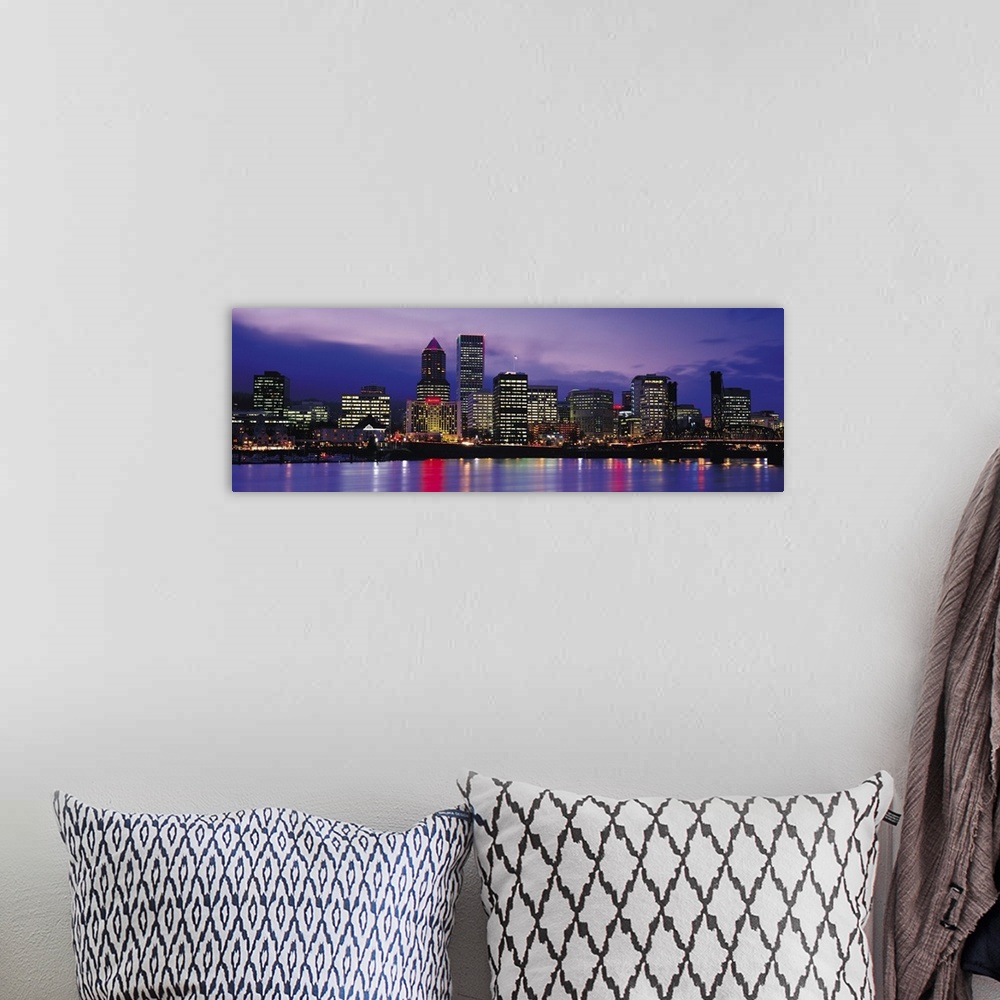 A bohemian room featuring Panoramic photograph on a big canvas of brightly lit buildings of the Portland skyline, reflectin...