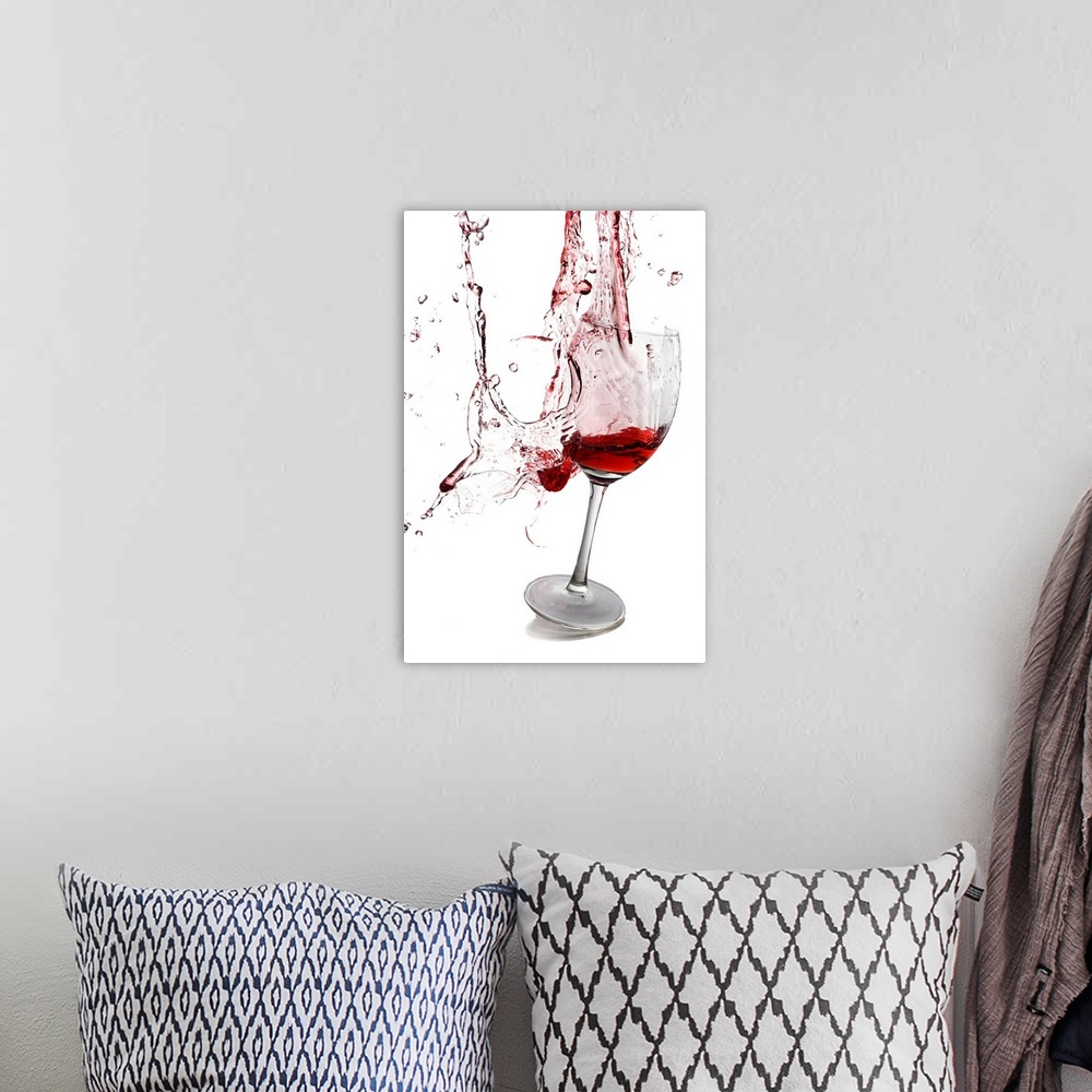 A bohemian room featuring Portrait photograph on a large wall hanging of a slightly tilted glass of red wine, the goblet ap...
