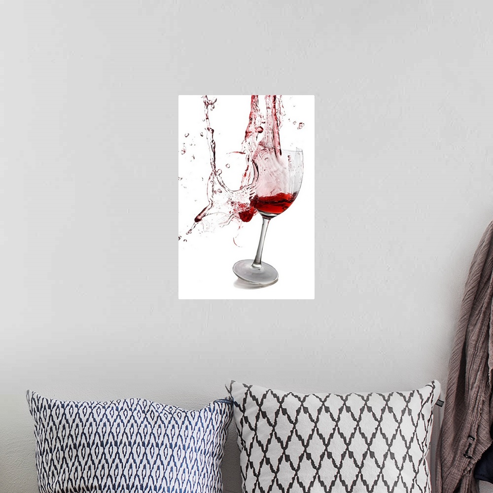 A bohemian room featuring Portrait photograph on a large wall hanging of a slightly tilted glass of red wine, the goblet ap...