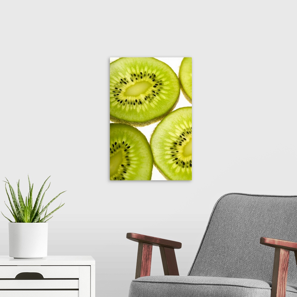 A modern room featuring Extreme close-up of four pieces of sliced kiwi fruit, part of