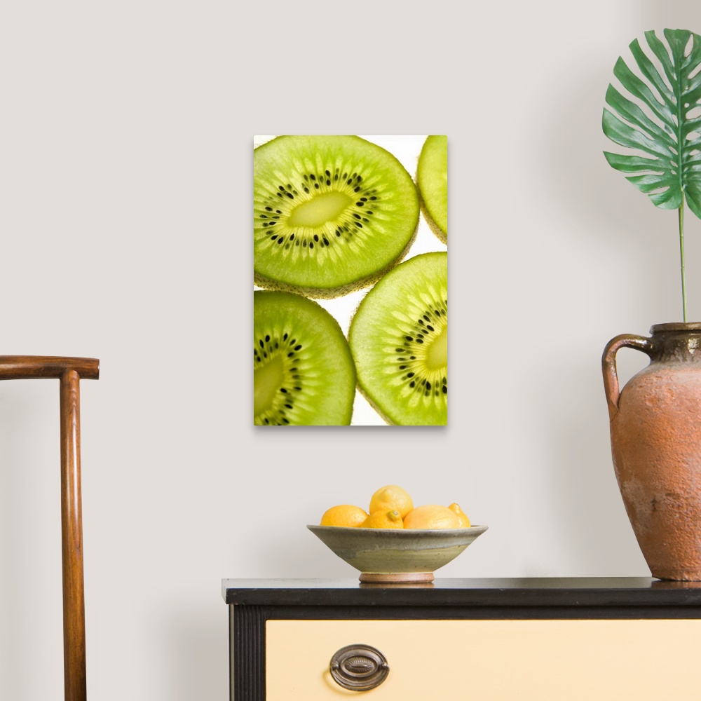 A traditional room featuring Extreme close-up of four pieces of sliced kiwi fruit, part of