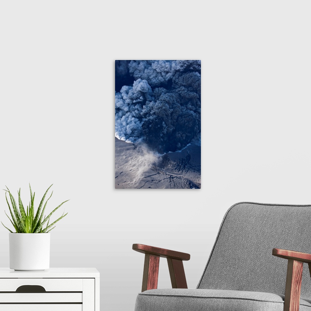 A modern room featuring Massive ash plume erupting through 200 meter thick glacial ice sheet at the summit of Eyjafjallaj...