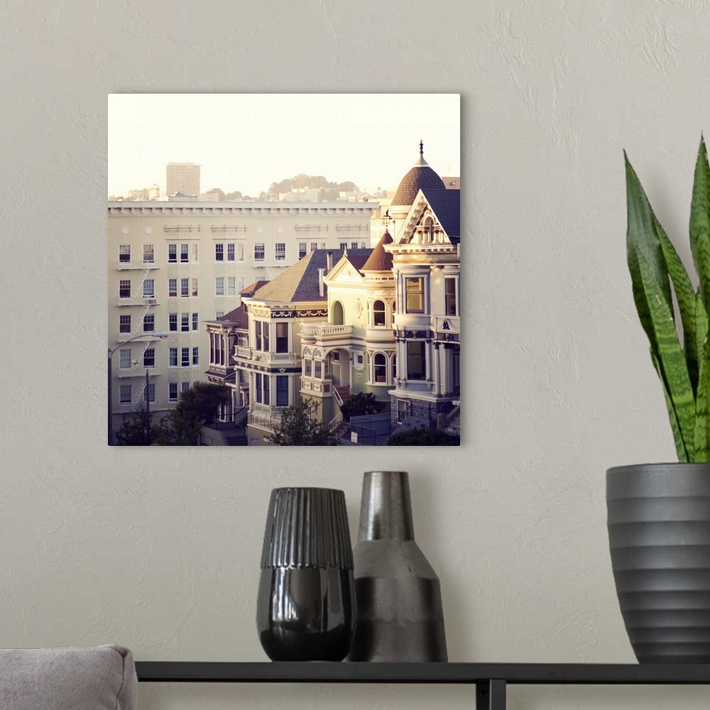 A modern room featuring Famous 'painted ladies' of Alamo Square, San Francisco, at sunset.