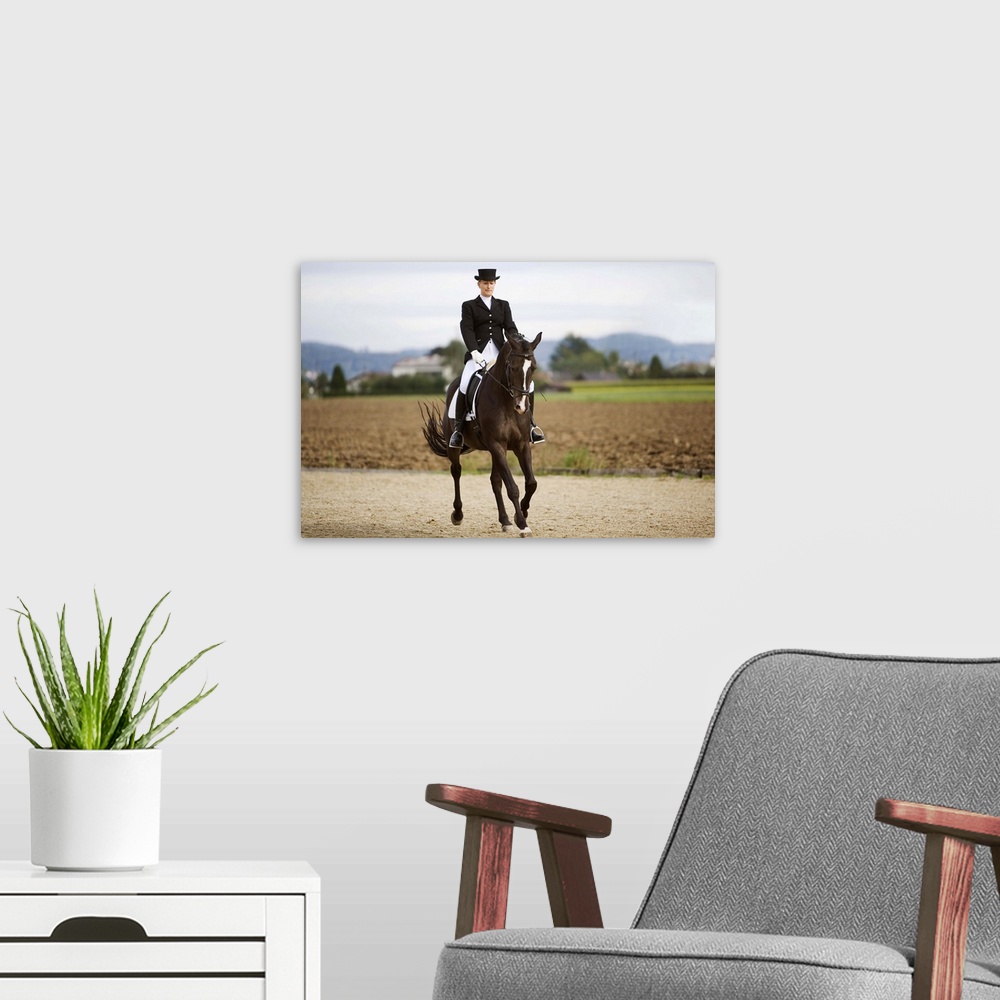A modern room featuring Female dressage rider exercising