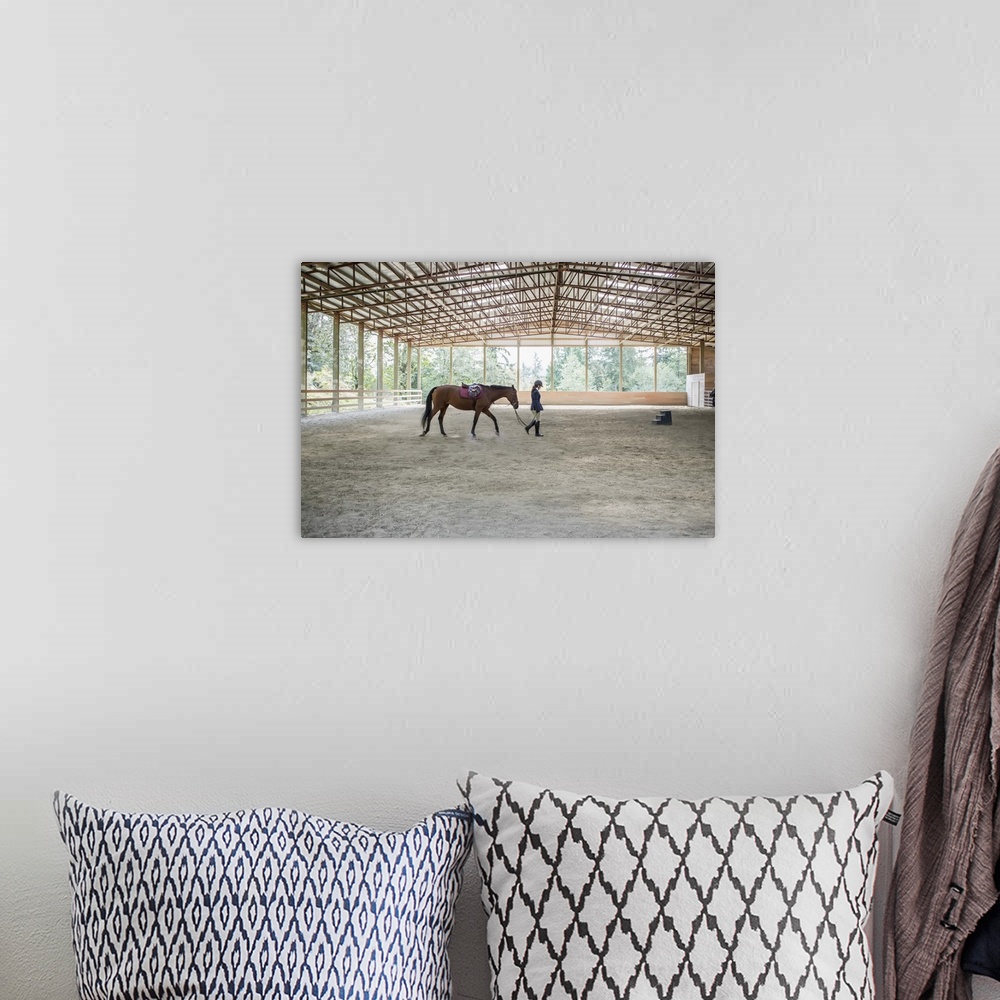 A bohemian room featuring Female equestrian walking horse in training arena