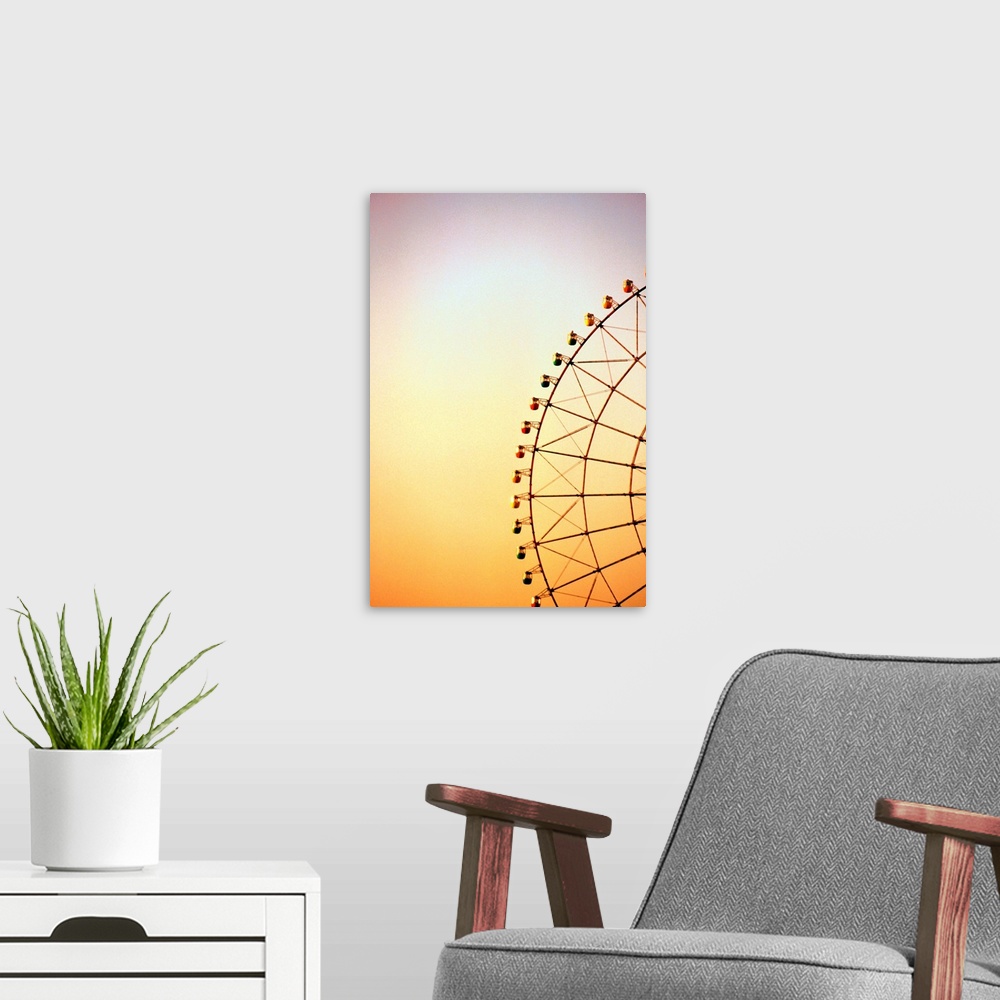 A modern room featuring Ferris wheel at dusk