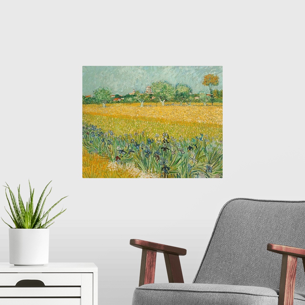 A modern room featuring Vincent van Gogh (Dutch, 1853-1890), Field with Irises near Arles, 1888. Oil on canvas, 65 x 54 c...