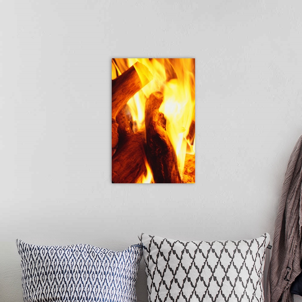 A bohemian room featuring Fire burning