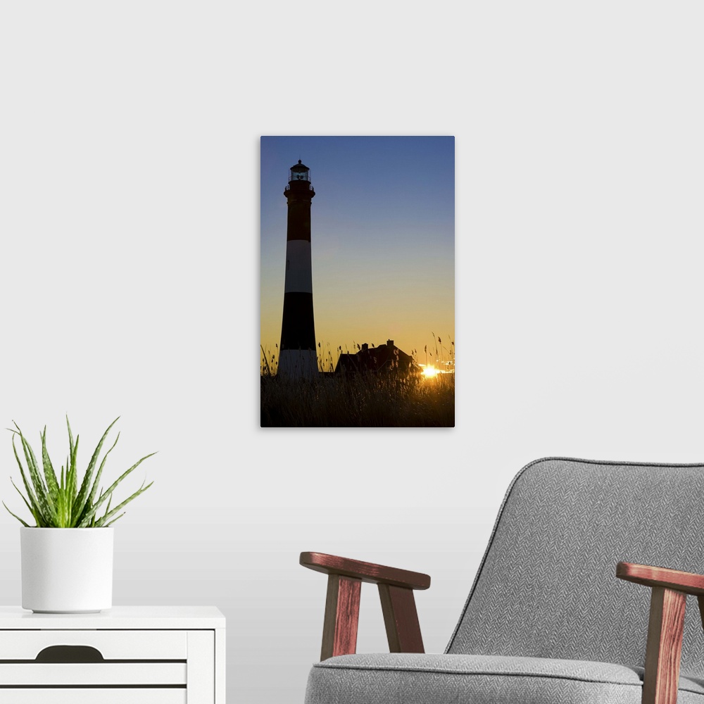A modern room featuring Fire Island Lighthouse, at sunrise. Long Island NY.