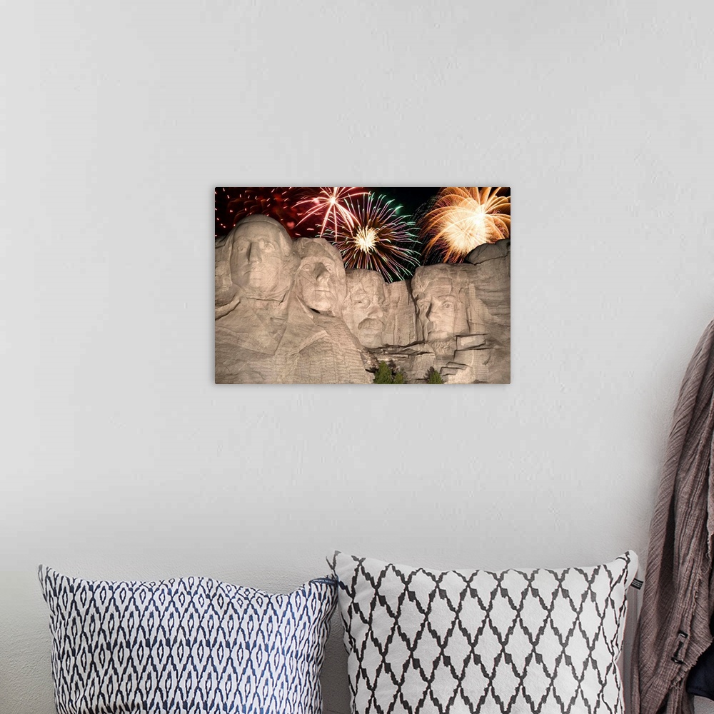 A bohemian room featuring Fireworks behind Mount Rushmore
