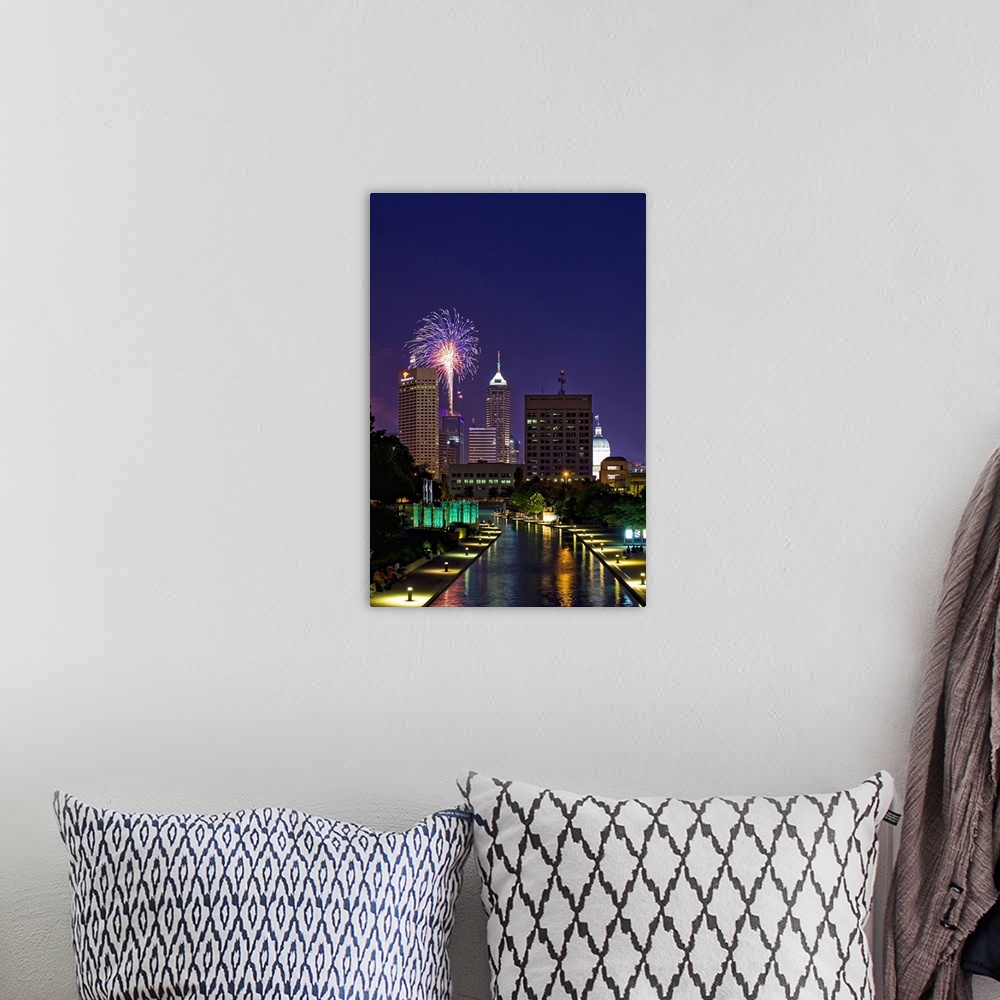 A bohemian room featuring Downtown Indianapolis with fireworks show in looking down west canal.