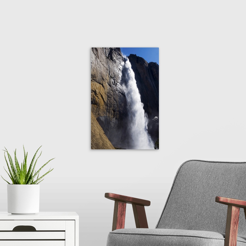 A modern room featuring First light on Upper Yosemite Fall at peak flow in the spring in Yosemite National Park, CA.