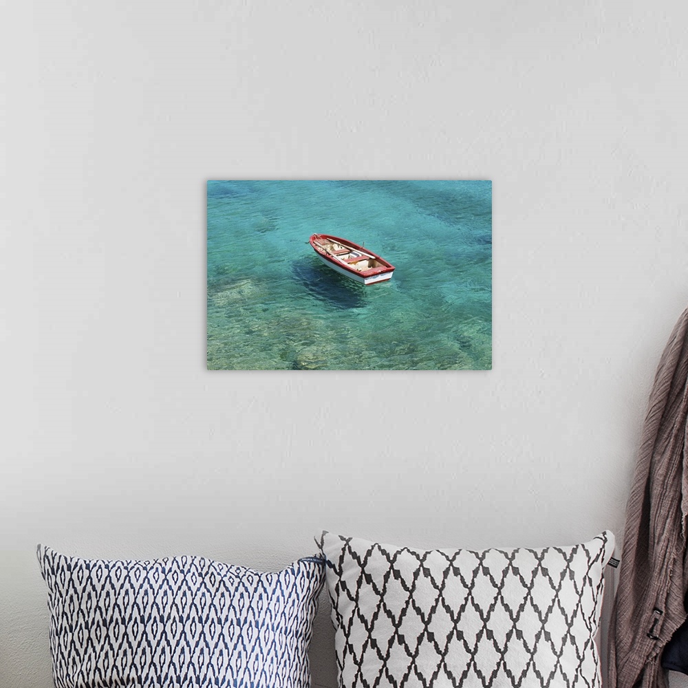 A bohemian room featuring Fishing boat in clear, colorful water, Mani region on Peloponnese