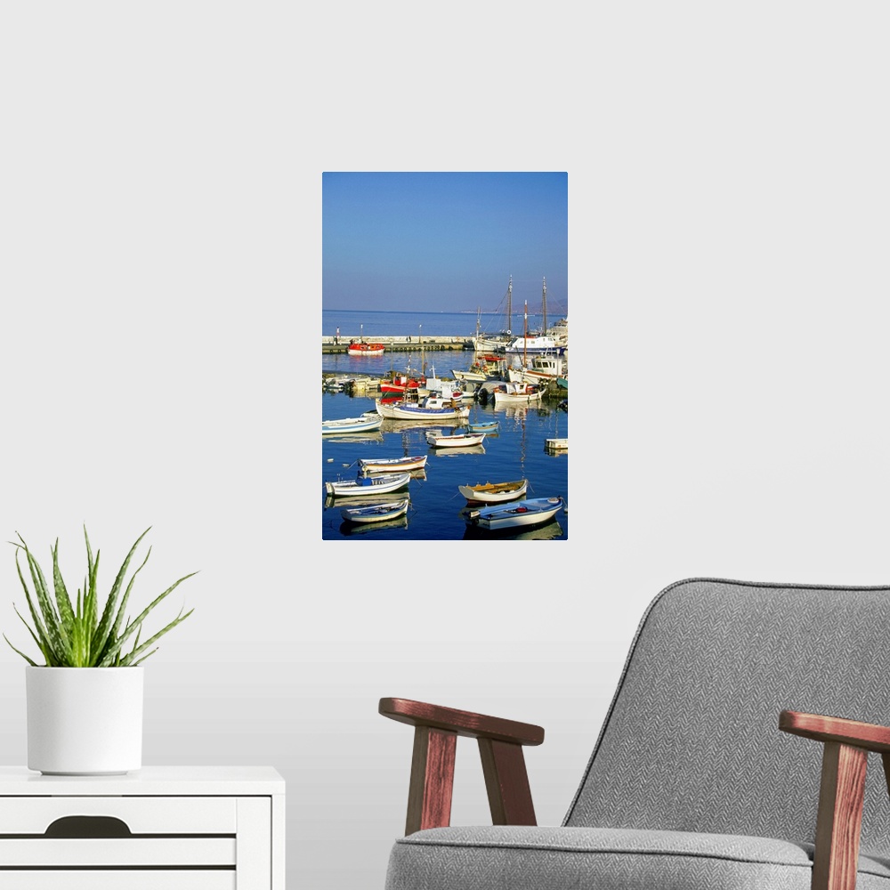 A modern room featuring Fishing boats docked at a harbor, Mykonos, Greece