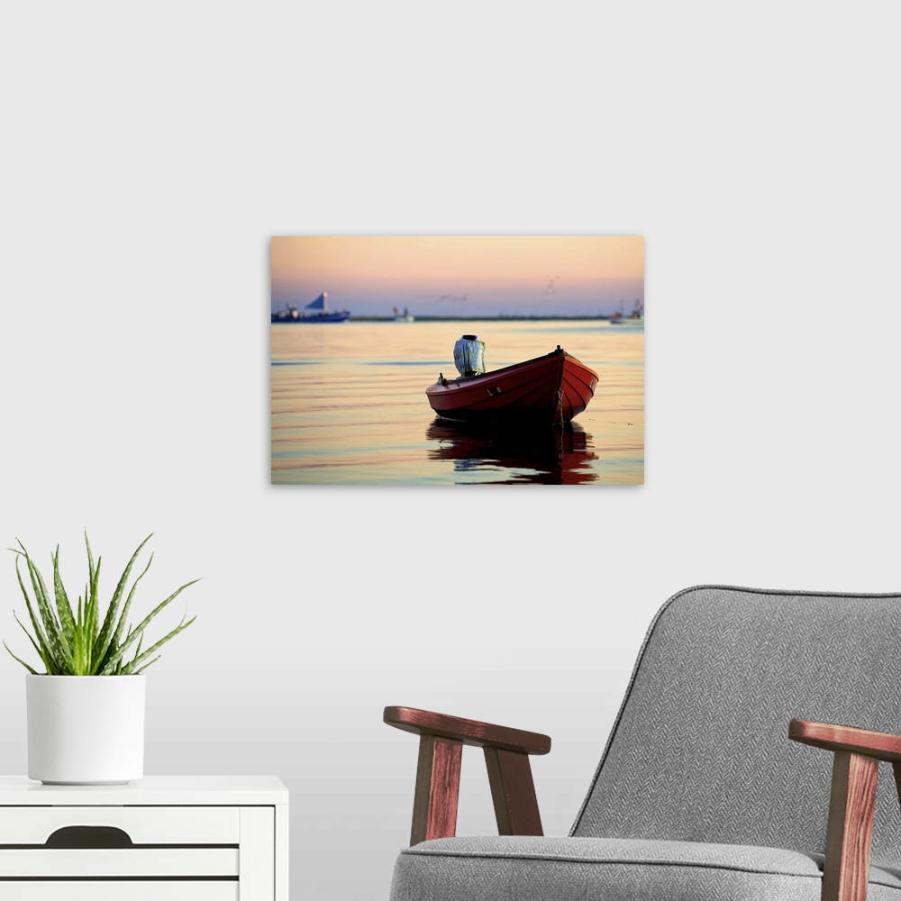 A modern room featuring Fishing boats leaving harbor in morning.