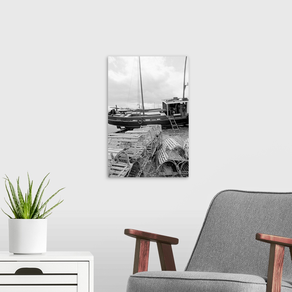 A modern room featuring black and white image of fishing vessel and lobster traps