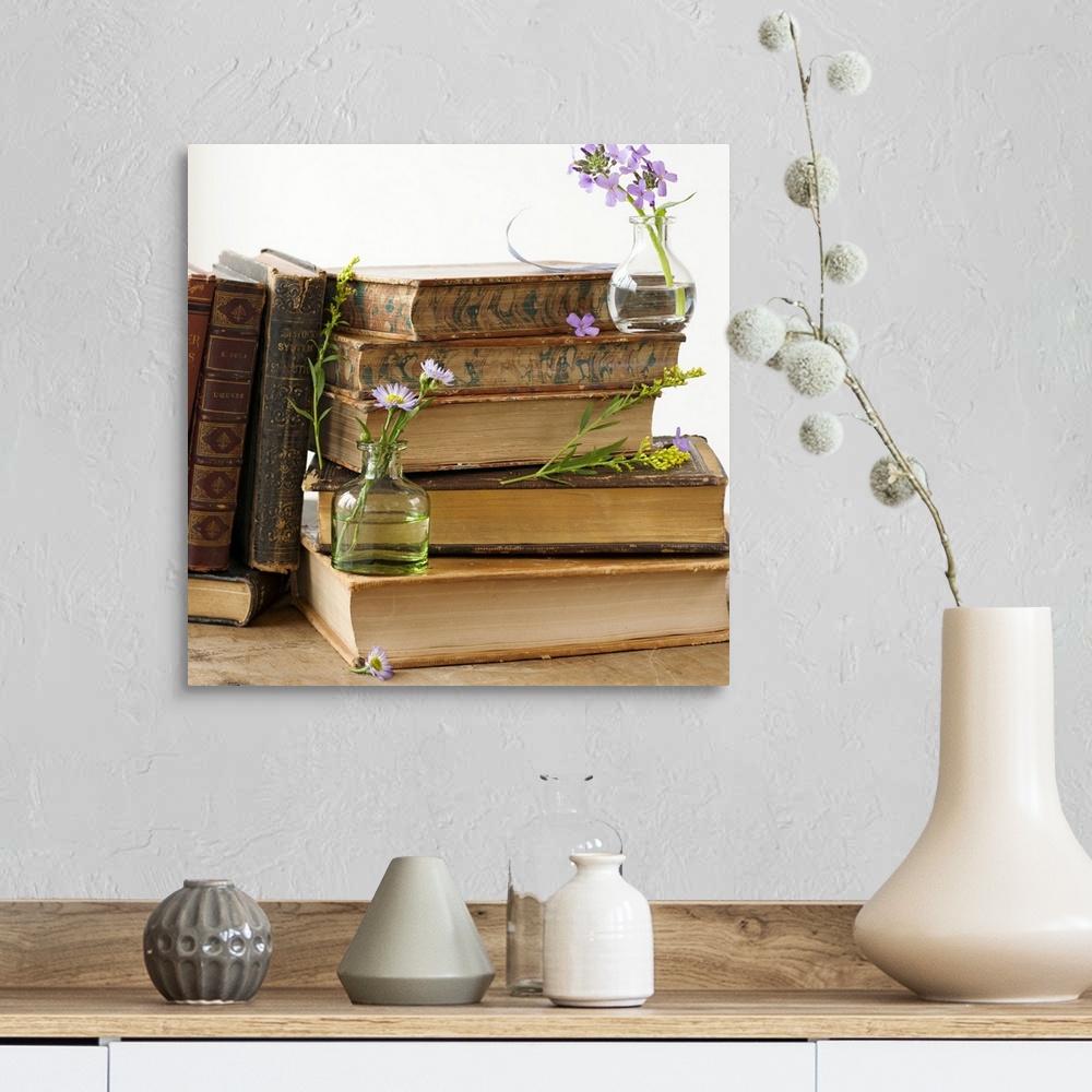 A farmhouse room featuring Flowers on old books