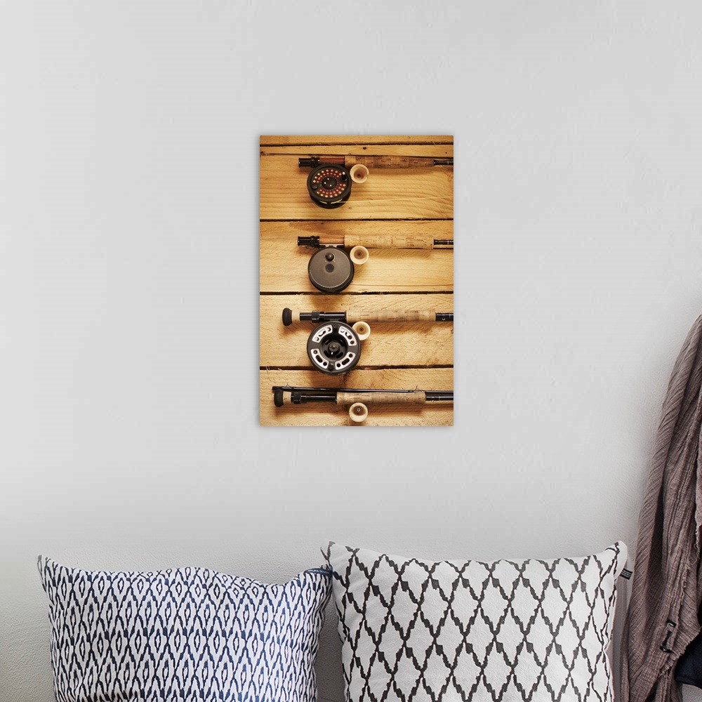 A bohemian room featuring Fly fishing reels hanging on wall