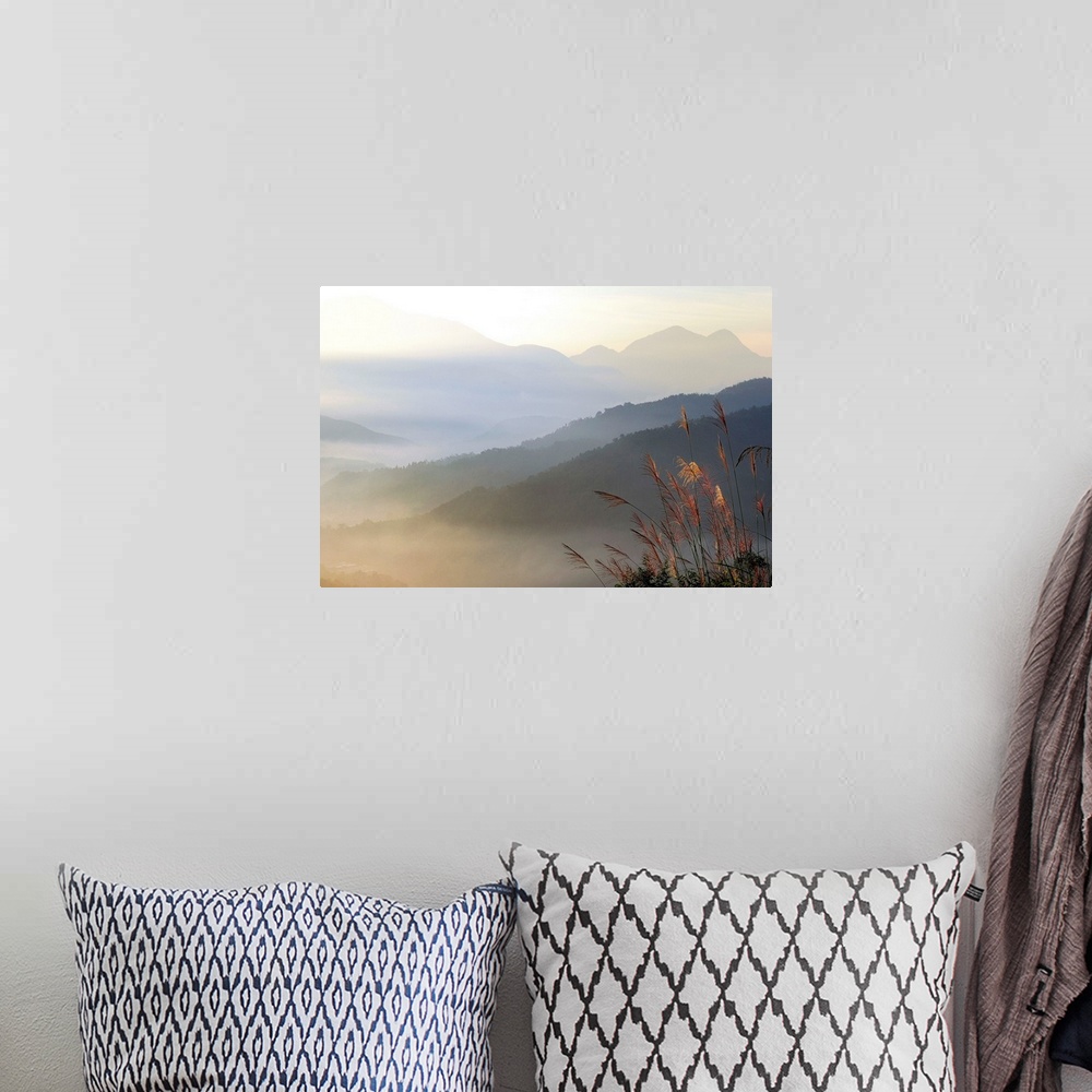 A bohemian room featuring Foggy mountain at sunrise against scenic view.