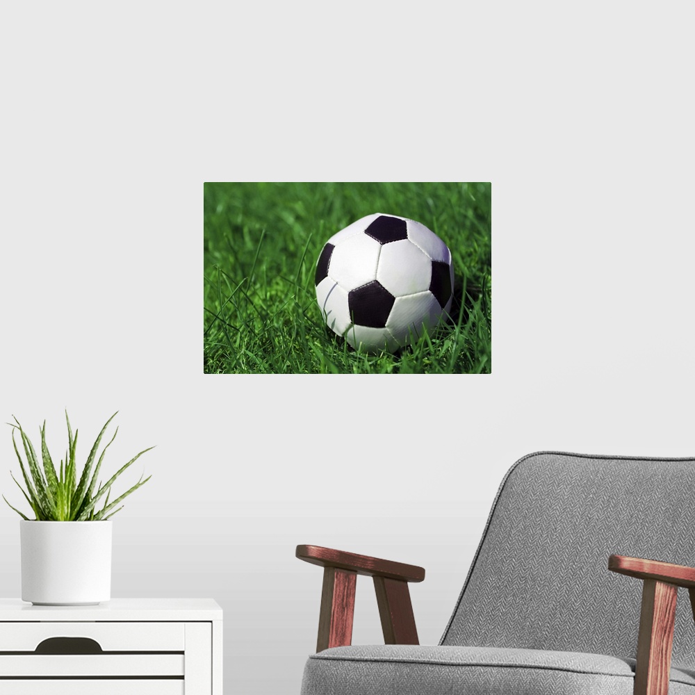 A modern room featuring Football on a grass field.