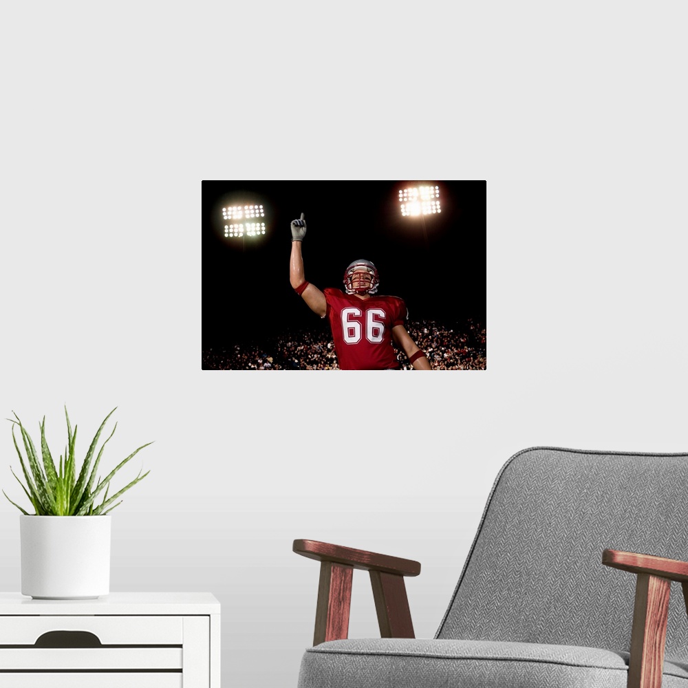 A modern room featuring Football player holding up index finger