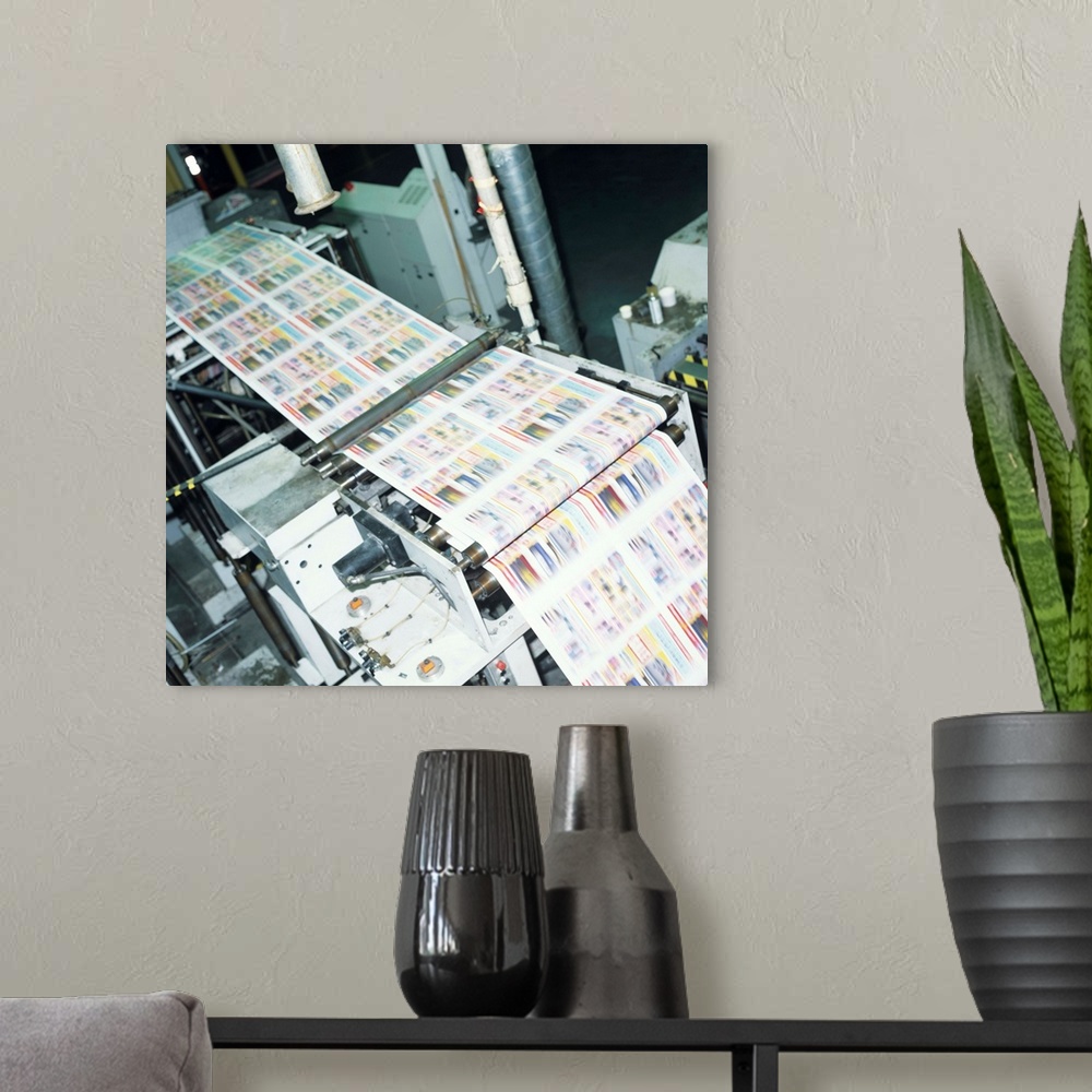 A modern room featuring 4 colour thermal ink web press in factory, elevated view