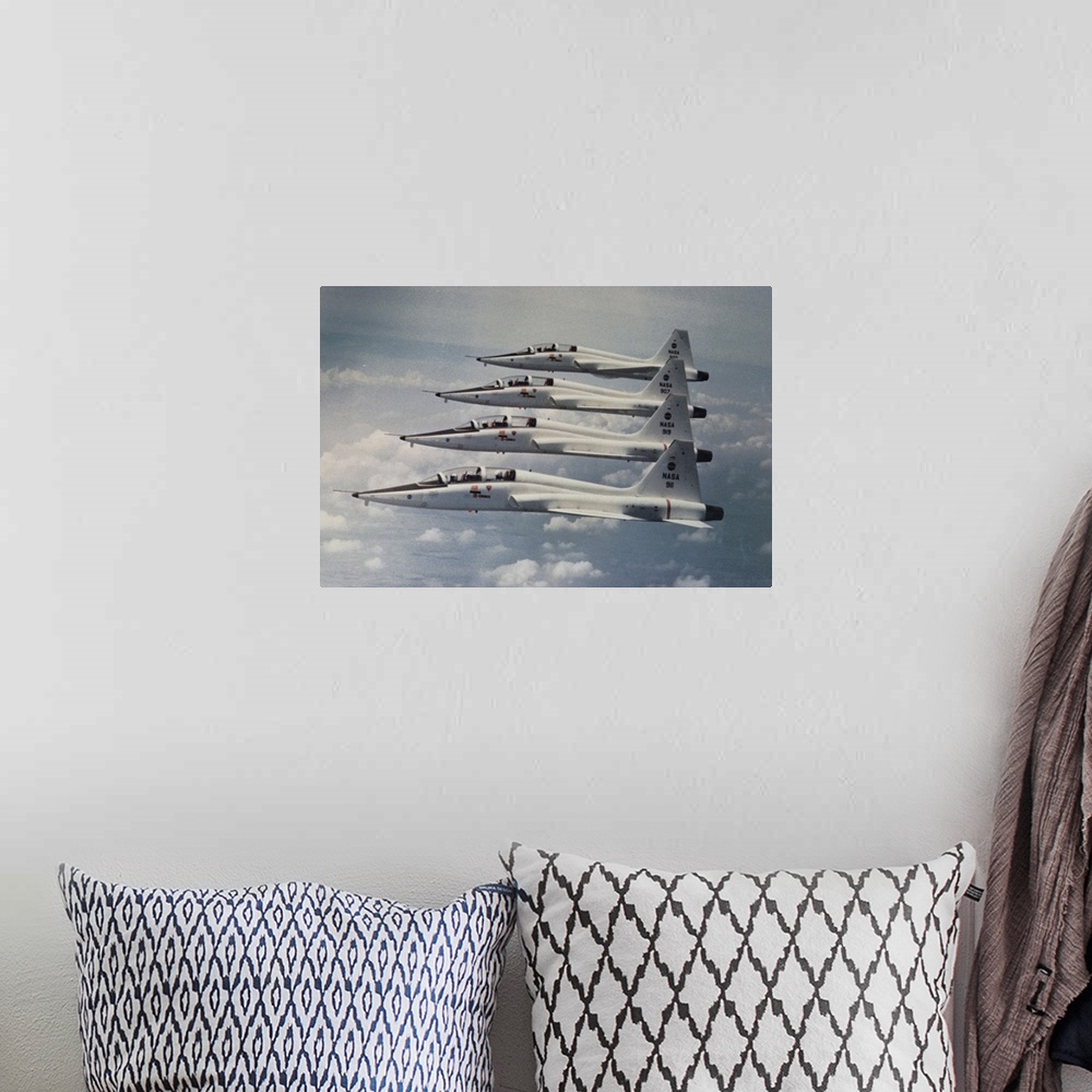 A bohemian room featuring Four Northrop T-38 Talon jet trainers