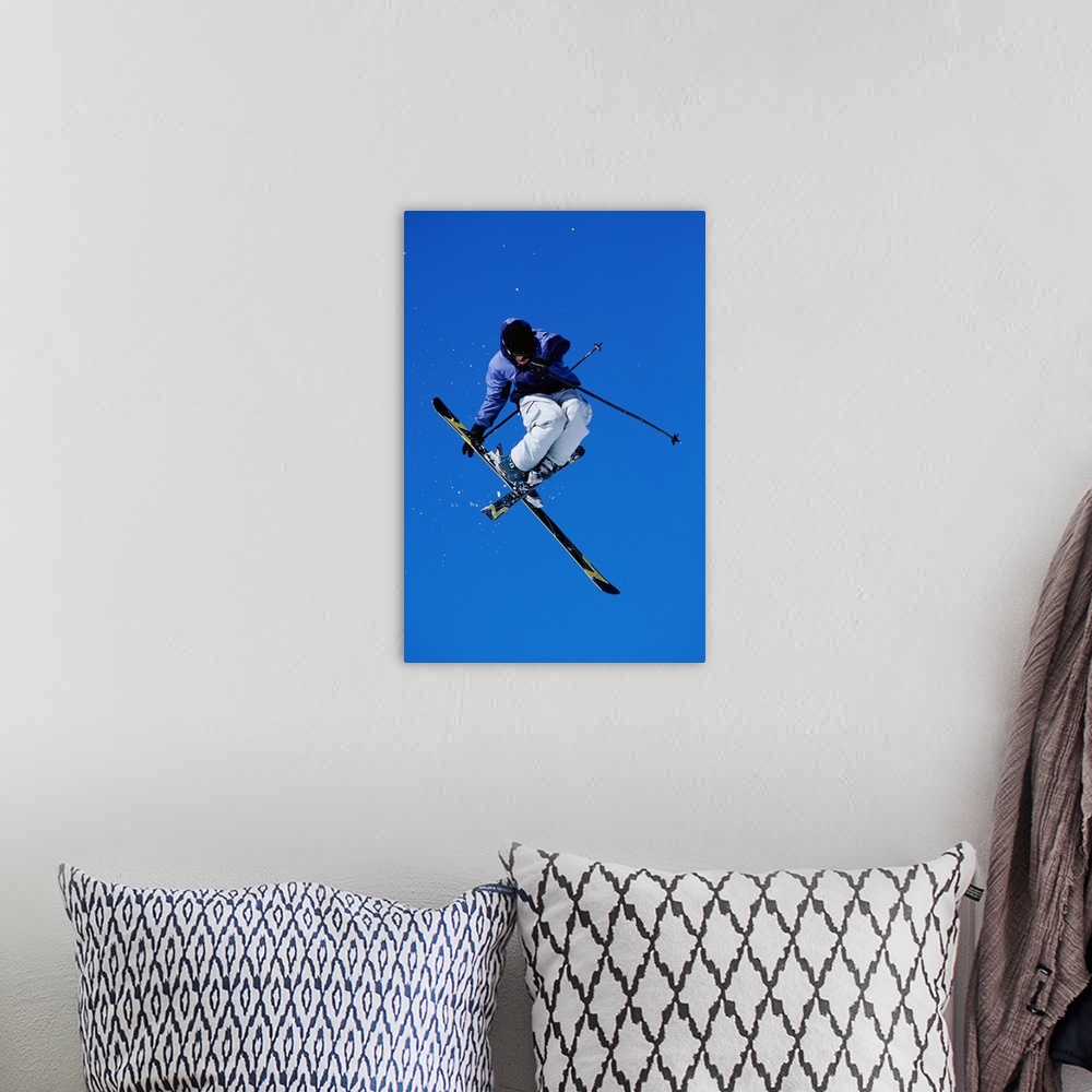 A bohemian room featuring Free skier in mid-air jump, low angle view