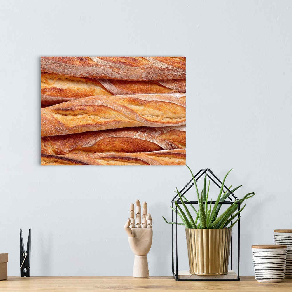 A bohemian room featuring Decorative artwork perfect for the home or kitchen of French bread loaves that have been closely ...