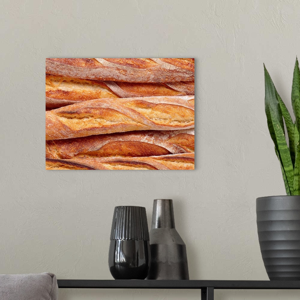 A modern room featuring Decorative artwork perfect for the home or kitchen of French bread loaves that have been closely ...