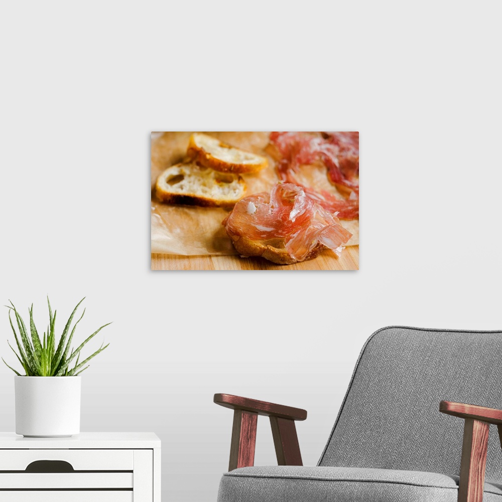 A modern room featuring Fresh prosciutto ham with bread