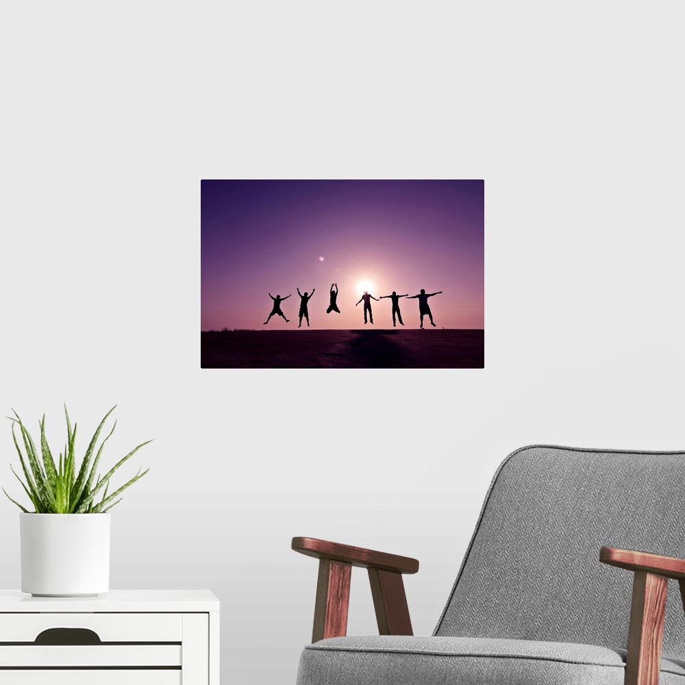 A modern room featuring Friends jumping against sunset on mountain, Bangladesh.