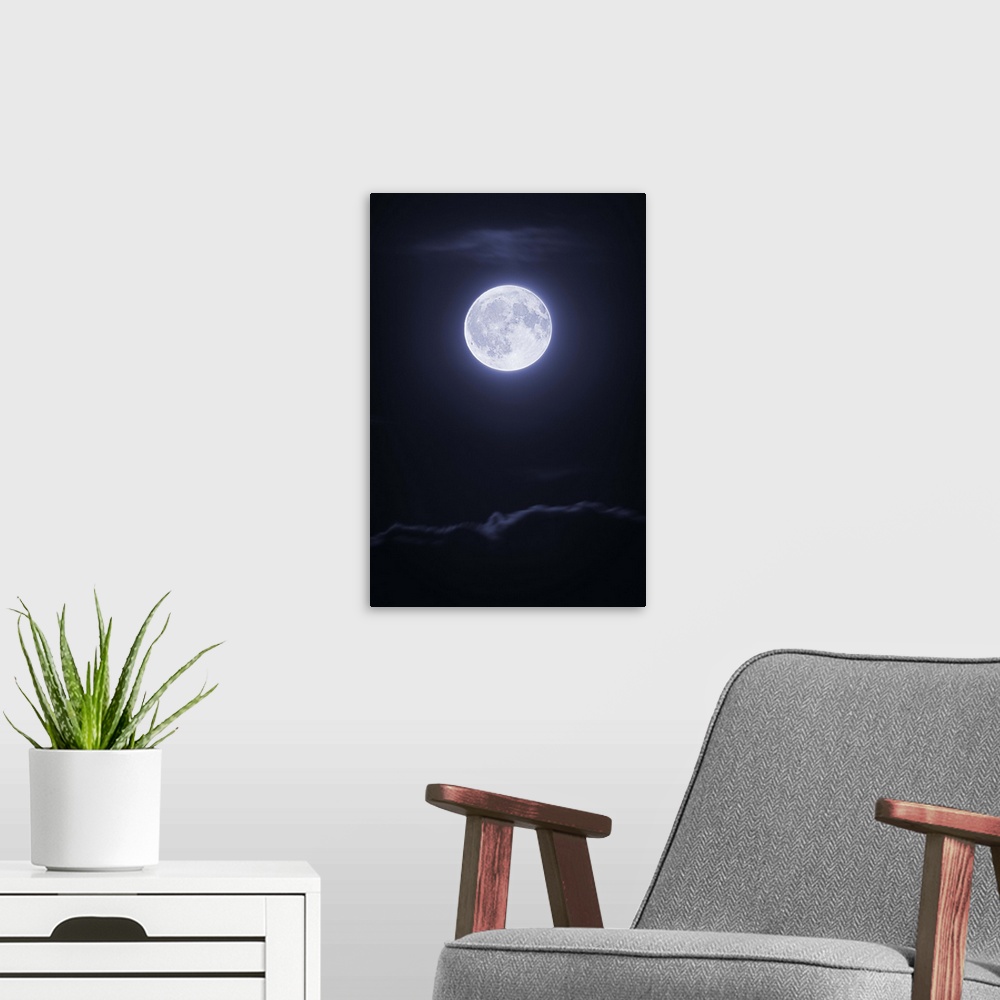 A modern room featuring Full moon with clouds at night
